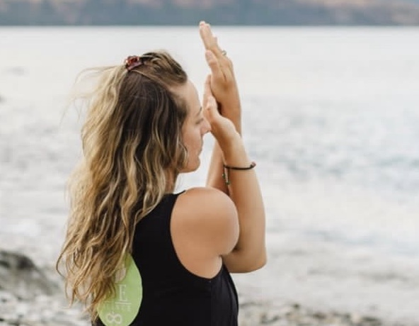 A person doing a calming Yin Yoga pose in Queenstown - Improve flexibility, reduce stress, and find balance in both body and mind with our expert instructor